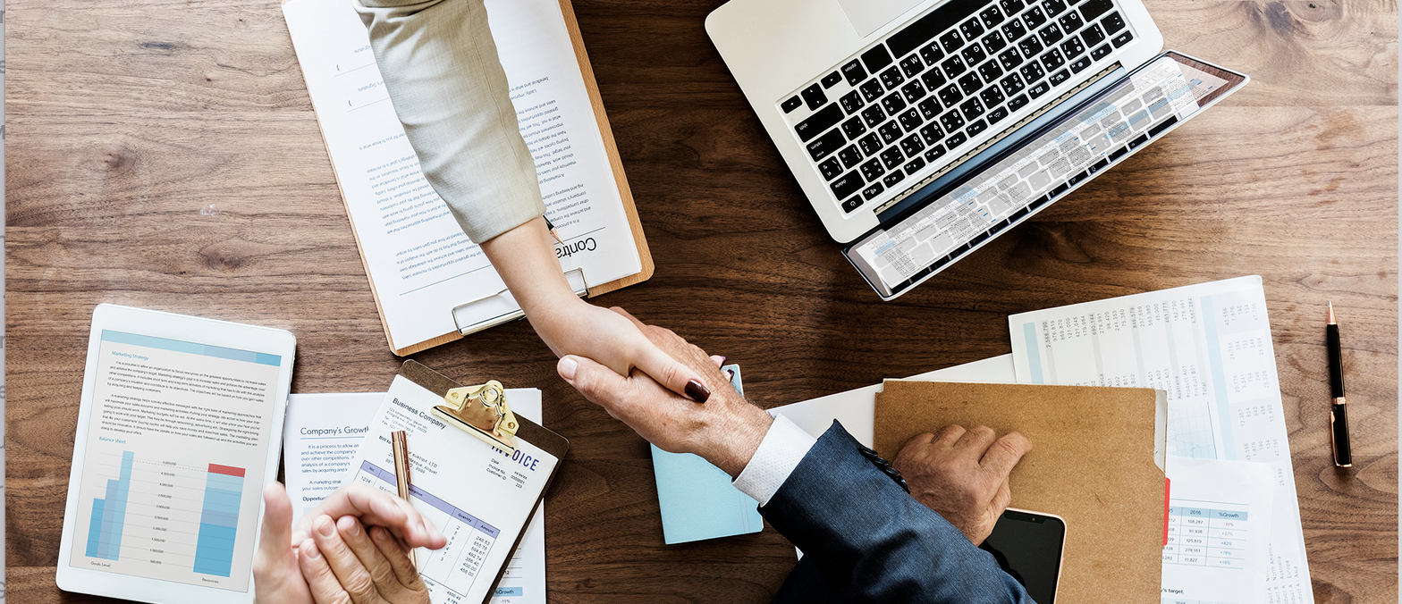 Handshake over desk.