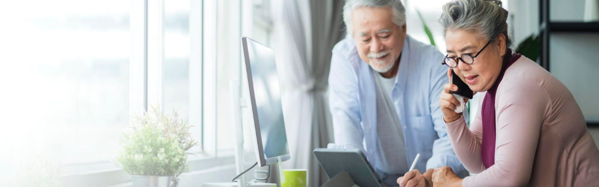 senior asian couple taxes