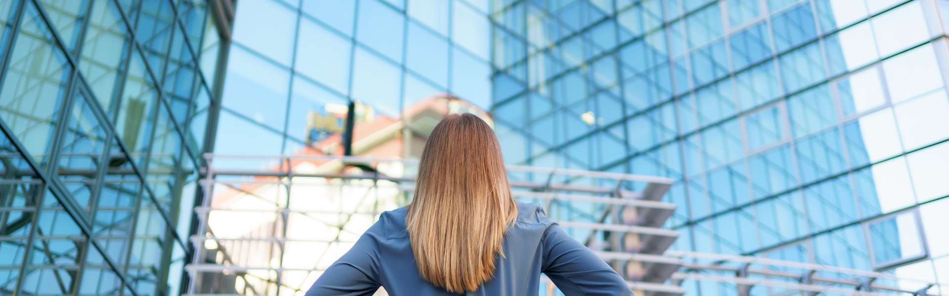 Woman facing skyscrapers