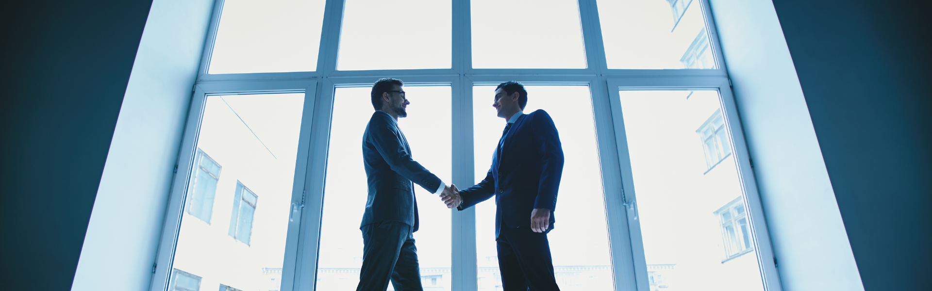 Two business men shaking hands