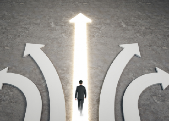 man walking on lit arrow pointing up