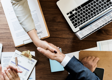 Handshake over desk.
