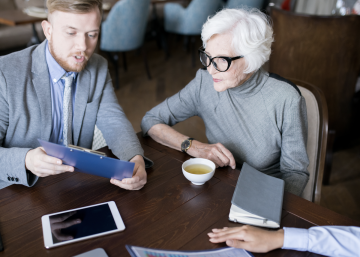 Businessman and women client having meeting in a cafe