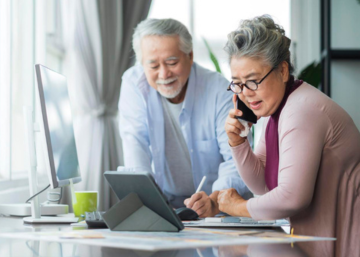 senior asian couple taxes