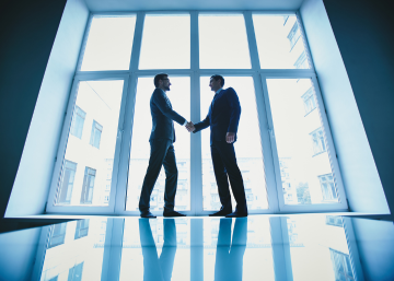 Two business men shaking hands